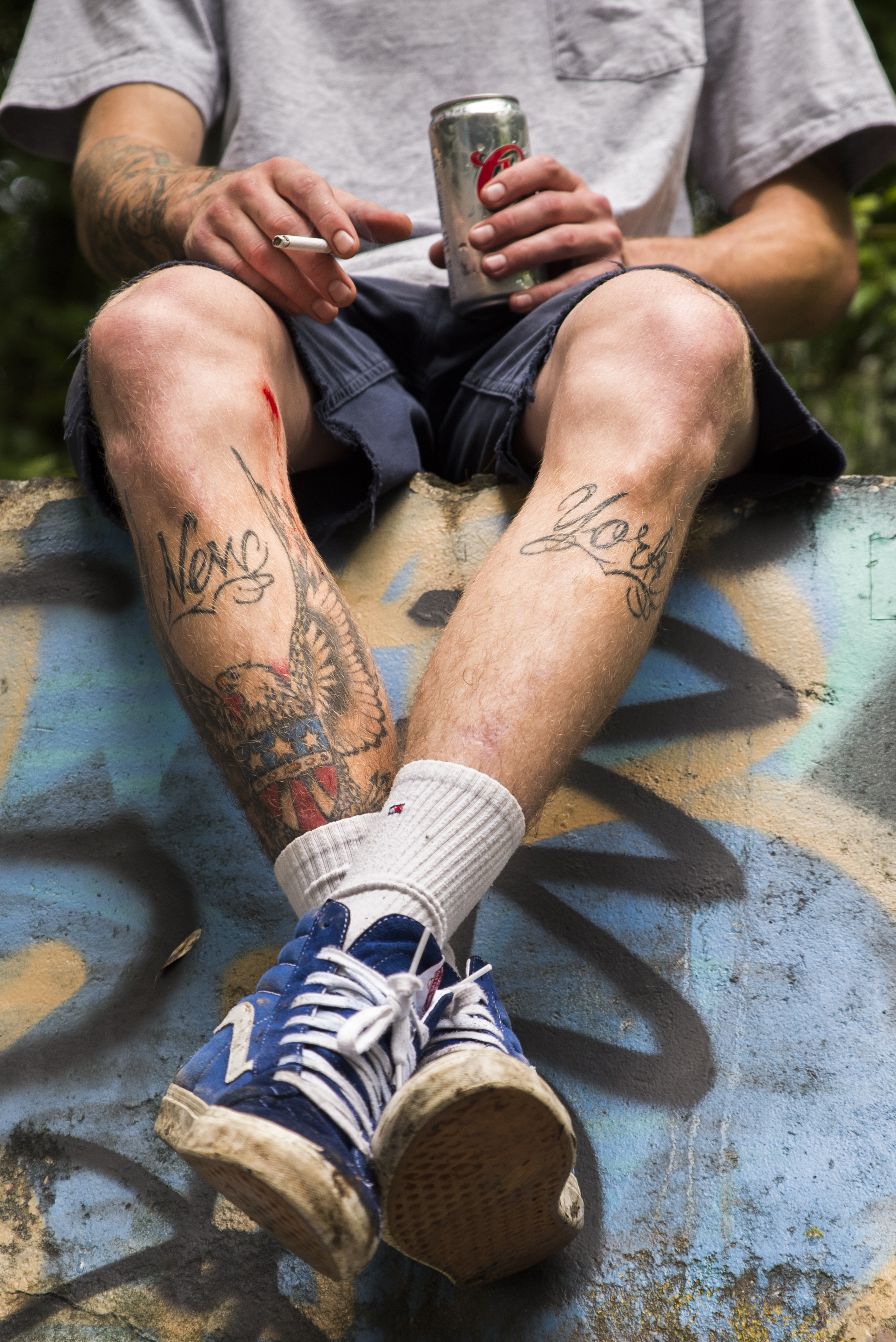 Garrett sits at the edge of an abandoned pool, Albany NY. Jul 7, 2014