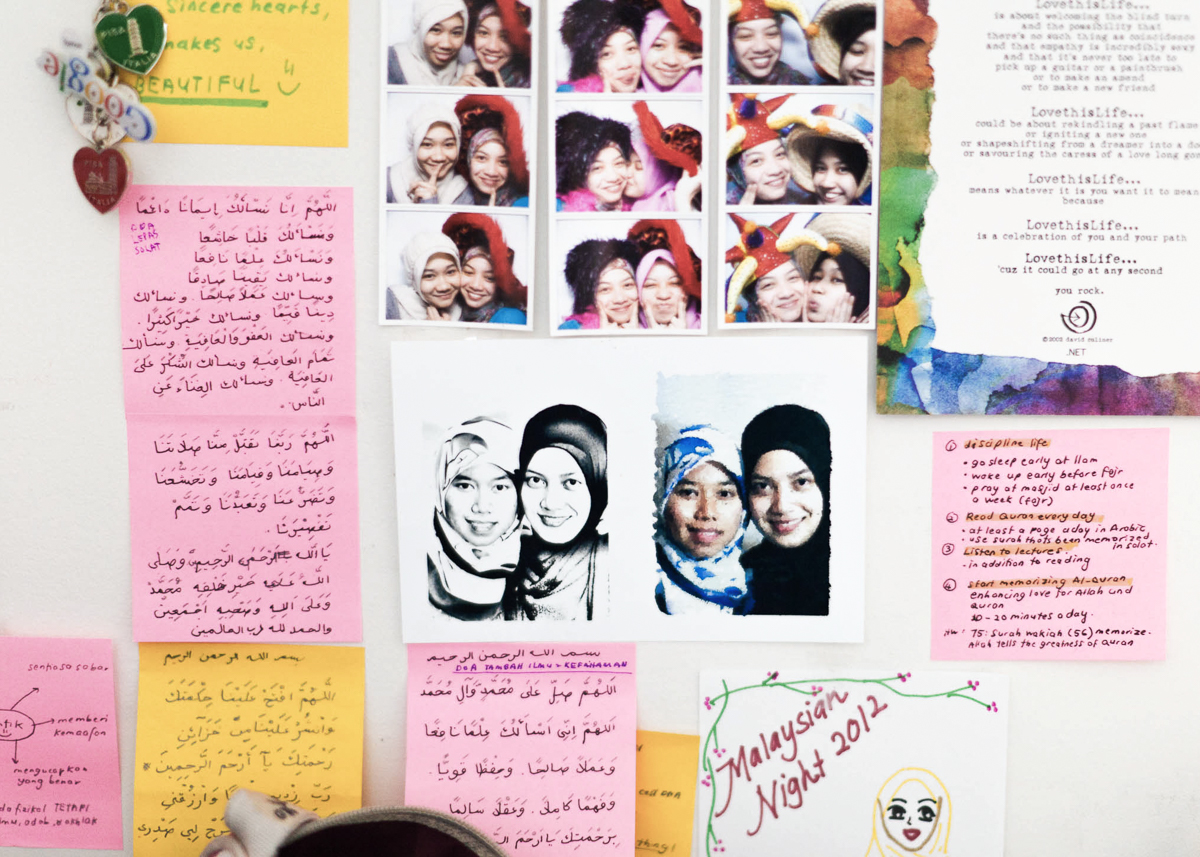 Riana's bedroom wall filled with pictures of friends and religious reminders. May 9, 2012.