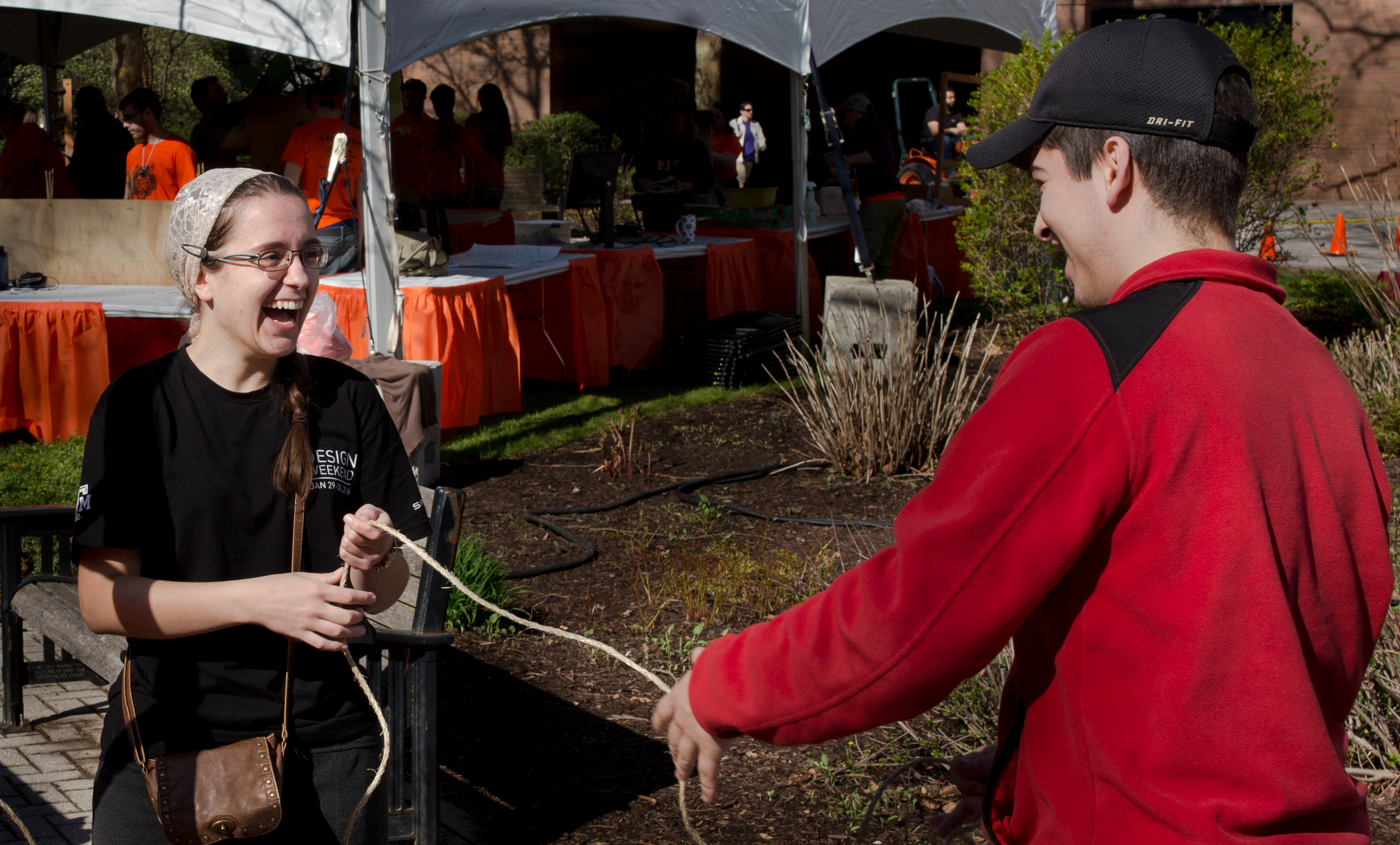 Solomiya Vysochanska, and Miguel Gutierrez, both Mechanical Engineering graduate students, set up a pulley system the morning before the Imagine RIT: Innovation and Creativity Festival on the Rochester Institute of Technology campus in Rochester, N.Y., May 7, 2016. Photo by Bridget Fetsko.  #imaginerit #ritpj