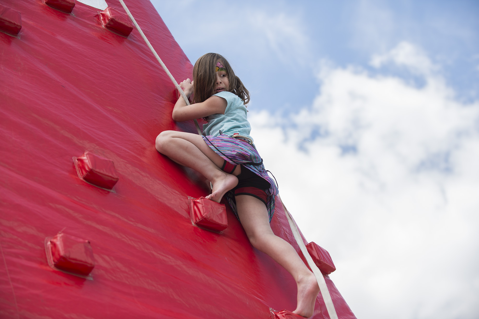 Sarah Bogumill climbs an inflatable mountain during Imagine RIT: Innovation and Creativity Festival on the Rochester Institute of Technology campus in Rochester, N.Y., May 7, 2016. (Photo by Kaitlyn Dolan) #imaginerit #ritpj