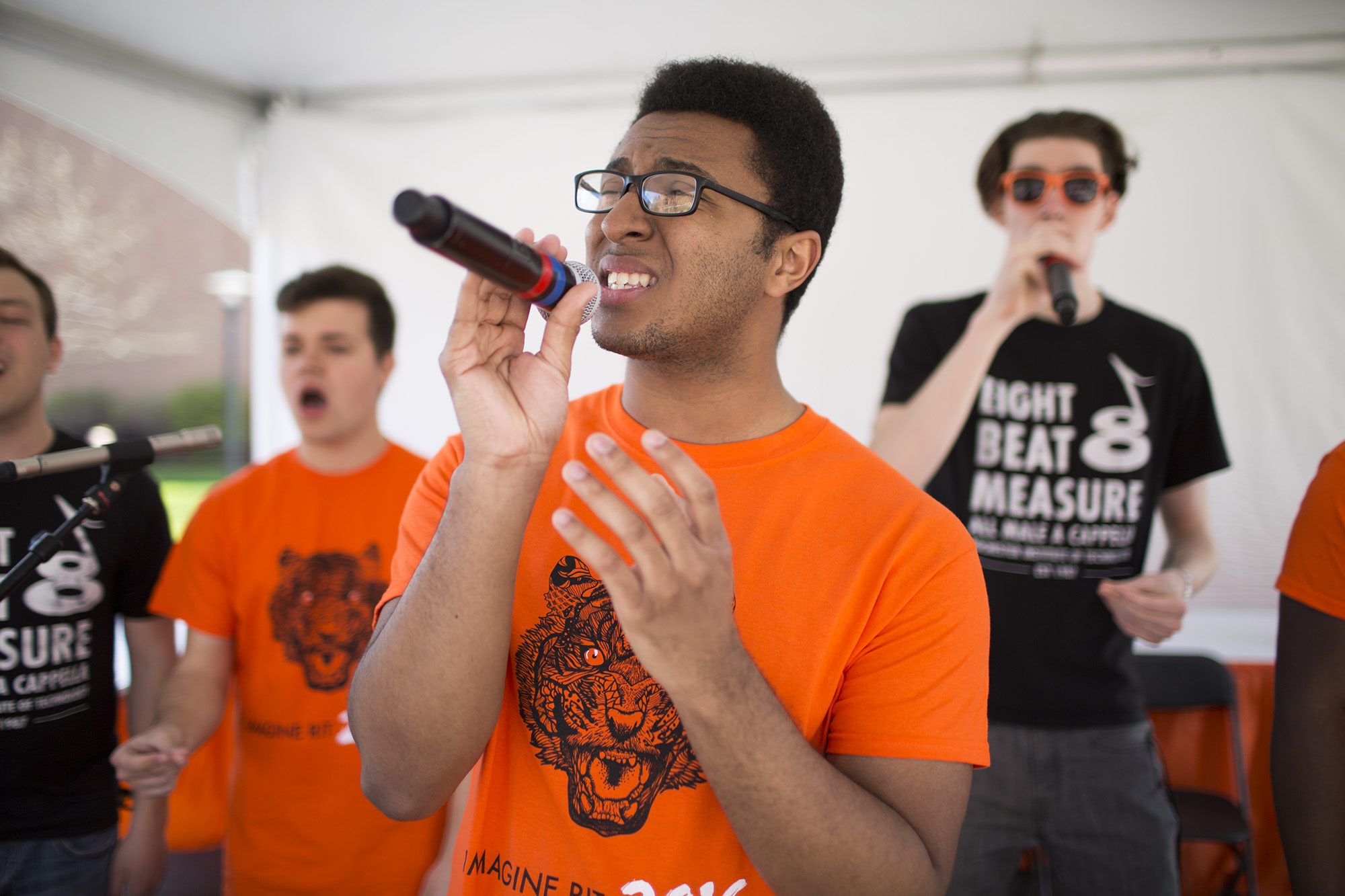 Deshawn Cervi (cq) sings during a performance by 8 Beat Measure during Imagine RIT: Innovation and Creativity Festival on the Rochester Institute of Technology campus in Rochester, N.Y., May 7, 2016.  (Photo by Tom Brenner)  #imaginerit #ritpj