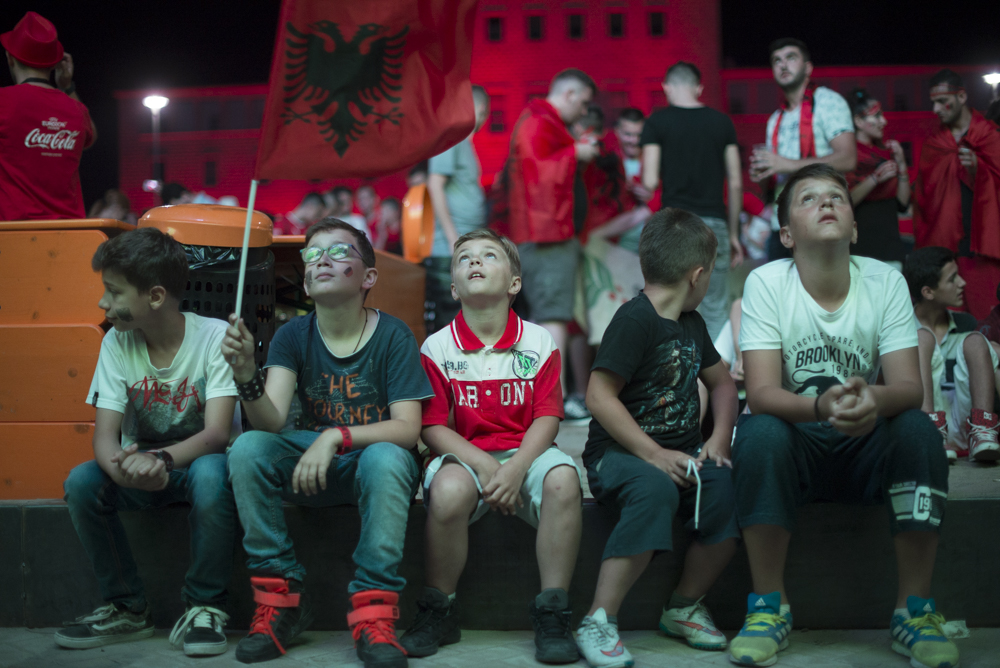 Children watch the Albania match against Romania in Tirana, Albania on June 19, 2016. Albania defeated Romania 1-0. 