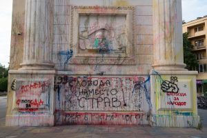 The Porta Macedonia in Skopje, Macedonia is covered in paint from protesters. This arch is one of many other monuments, sculptures, and facades that were, and continue to be build as a part of the Skopje 2014 project. 