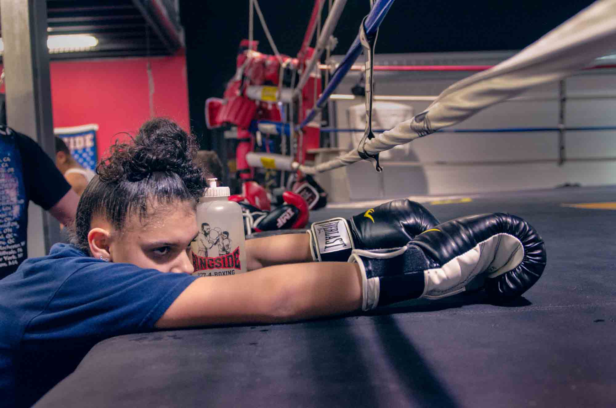 Fifteen-year-old Celina Carissimi of the Geneva Boxing Team takes a break during practice at her home gym in Geneva, NY January 9, 2012. In less than two years Celina has become a 3 time state champion. 