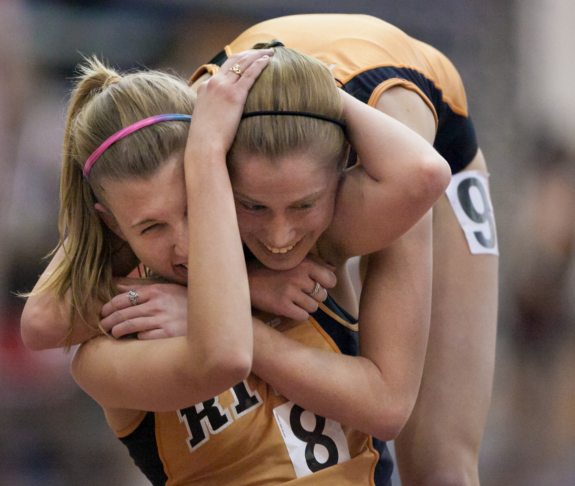 Rachel Zoyhofski, left, and Amanda Dole of the Rochester Institute of Technology hug after finishing the 5000 meter run at the Liberty League Indoor Track and Field Championships at RIT's Gordon Field House in Henrietta, N.Y., on Saturday, Feb. 9, 2013. Both women hit the qualifying standard for the ECAC Championship meet after running the race mostly together and finishing a little more than a second apart.