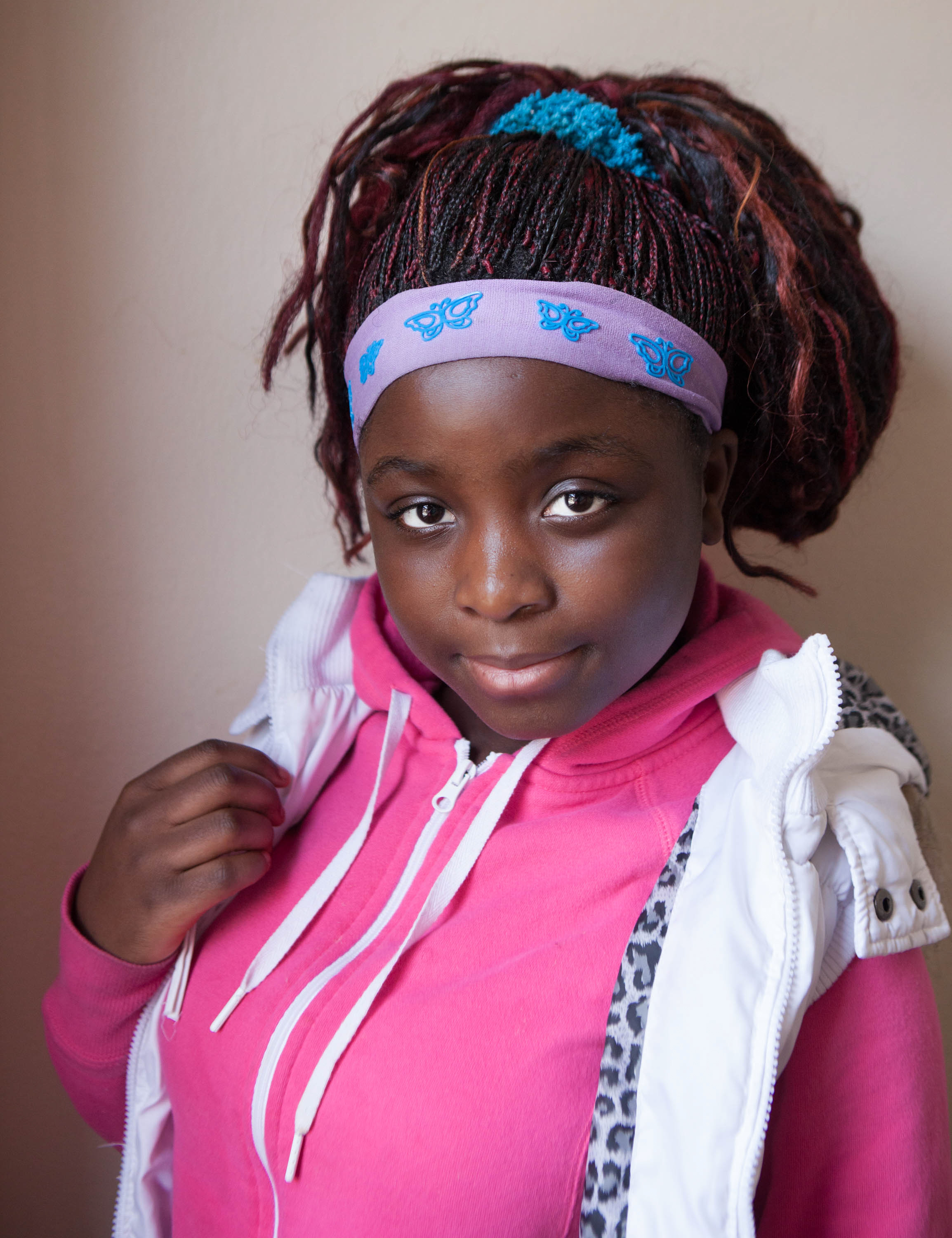 Salome Kasinge, 14, a refugee from Zambia, poses for a portrait at Mary's Place, a refugee outreach center in Rochester, NY. Salome came to the United States when she was 11 and Mary's Place helped her learn English quickly.