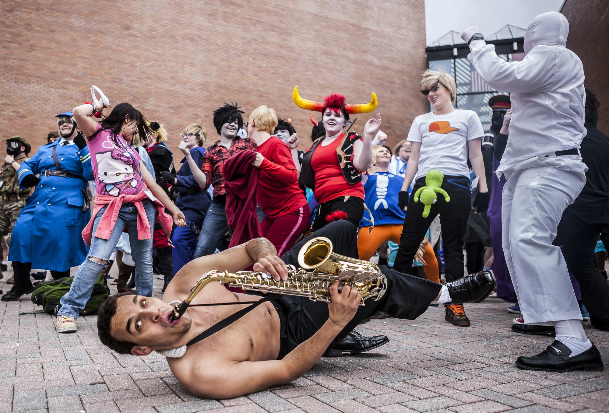 Rochester Institute of Technology third year Imaging Science major Sam Valerio (center) plays his saxophone during a "Harlem Shake" video during "Tora-Con" day, on March 23, 2013.