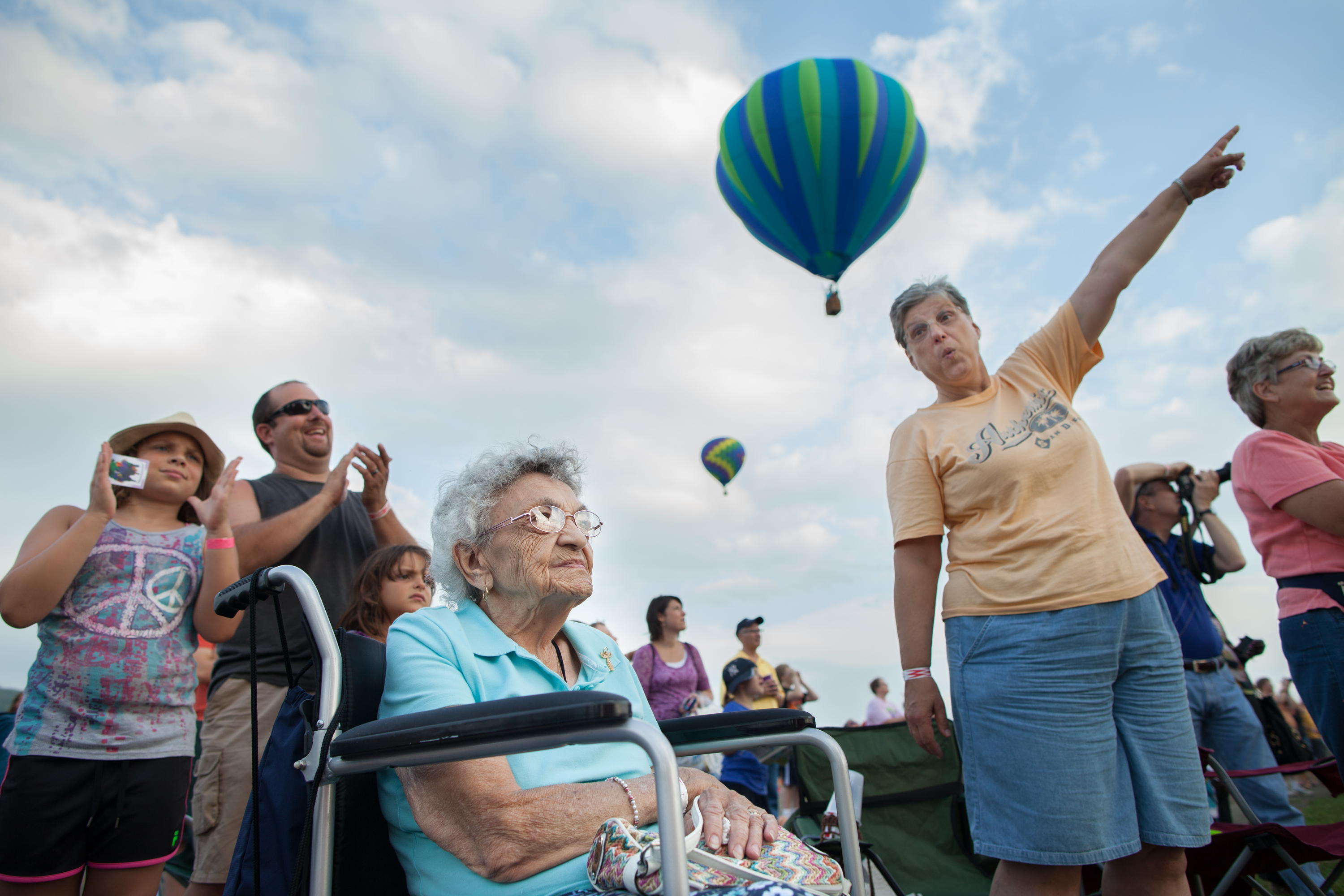 Surrounded by family, Gertrude Zelma, 93, of Akron, NY, watches hot air balloons launch at the 32nd Annual New York State Festival of Balloons in Dansville, NY on Aug. 31, 2013. Gertrude's niece, right, teased that the family will send her up in a hot air balloon on her 100th birthday.