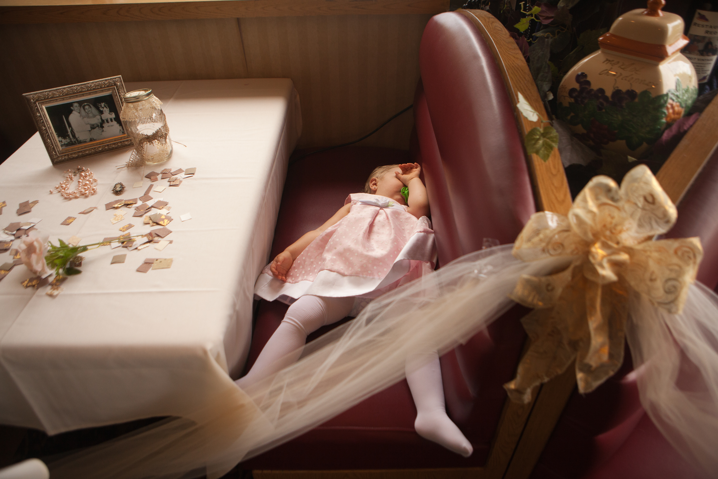 The daugter of a bridesmaid takes a nap during Valerie Coccia's bridal shower at Red Fedele's Brook House in Greece, NY on Saturday July 13, 2013.