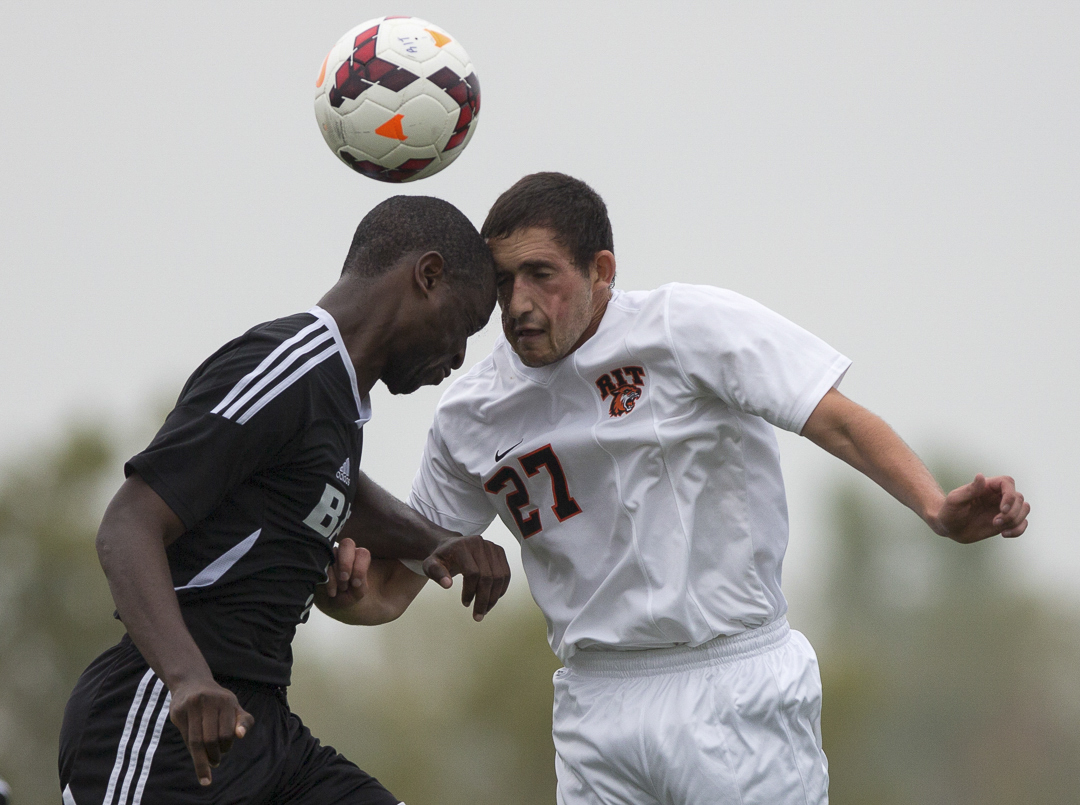 Kurt Spiegel a Junior at RIT bangs heads with Gabriel Kilongo a Junoir at Bard College during a Mens soccer game between RIT and Bard College in  Henrietta New York on10/4/2013 which ended with a final score of 4-0 RIT. Photo by Flannery Allison 