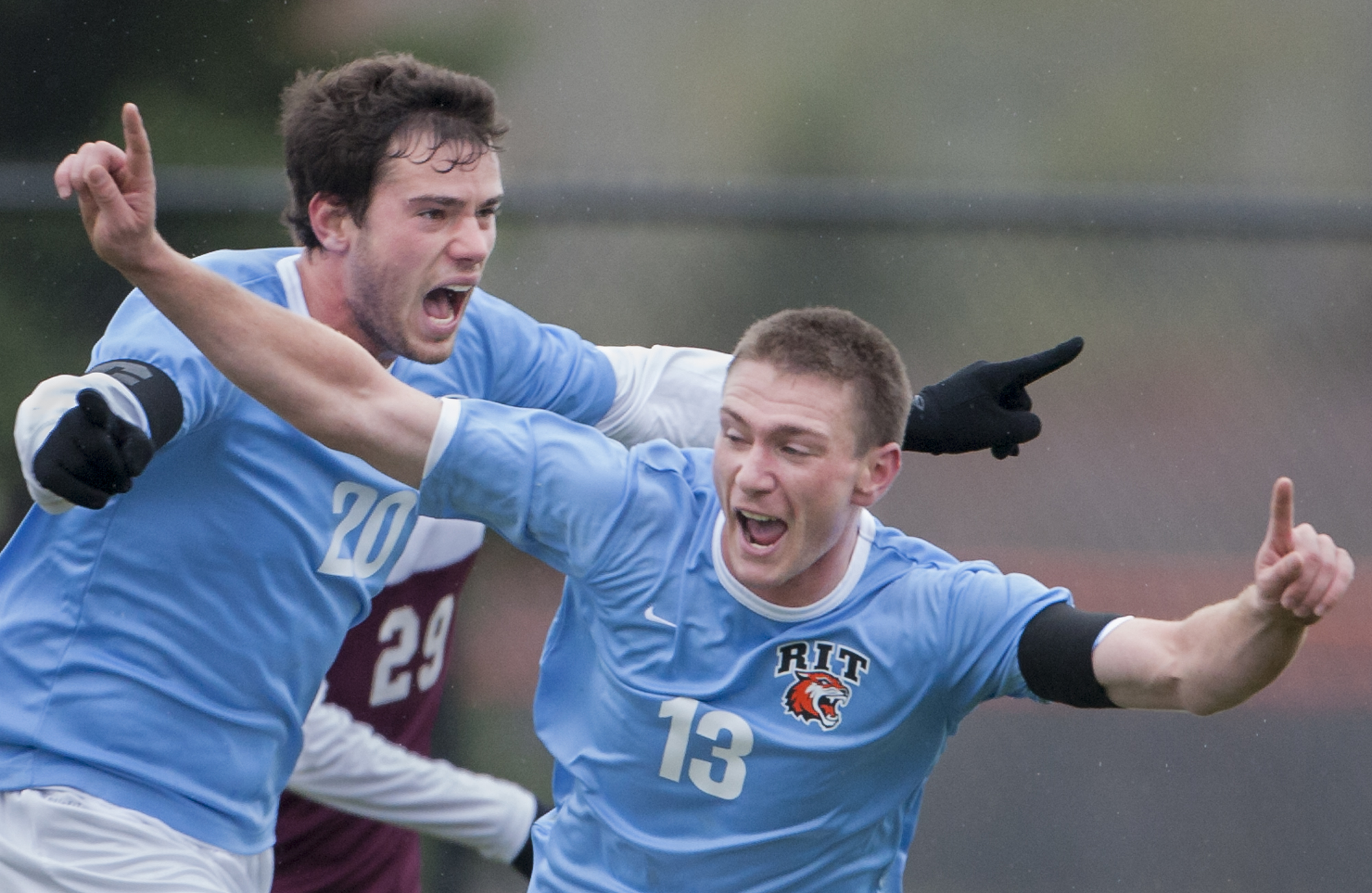  Andy Fleckenstein of RIT #20-senior captain, left, and Jimmy Forbes of RIT #13-senior captain, right, celebrate Forbes' goal during the the first half of the men's soccer game against Union at Rochester Institute of Technology's Tiger Stadium in Henrietta, N.Y., on Saturday, Oct. 26, 2013. RIT won 1-0. (Photo by Josh Barber/RIT SportsZone)