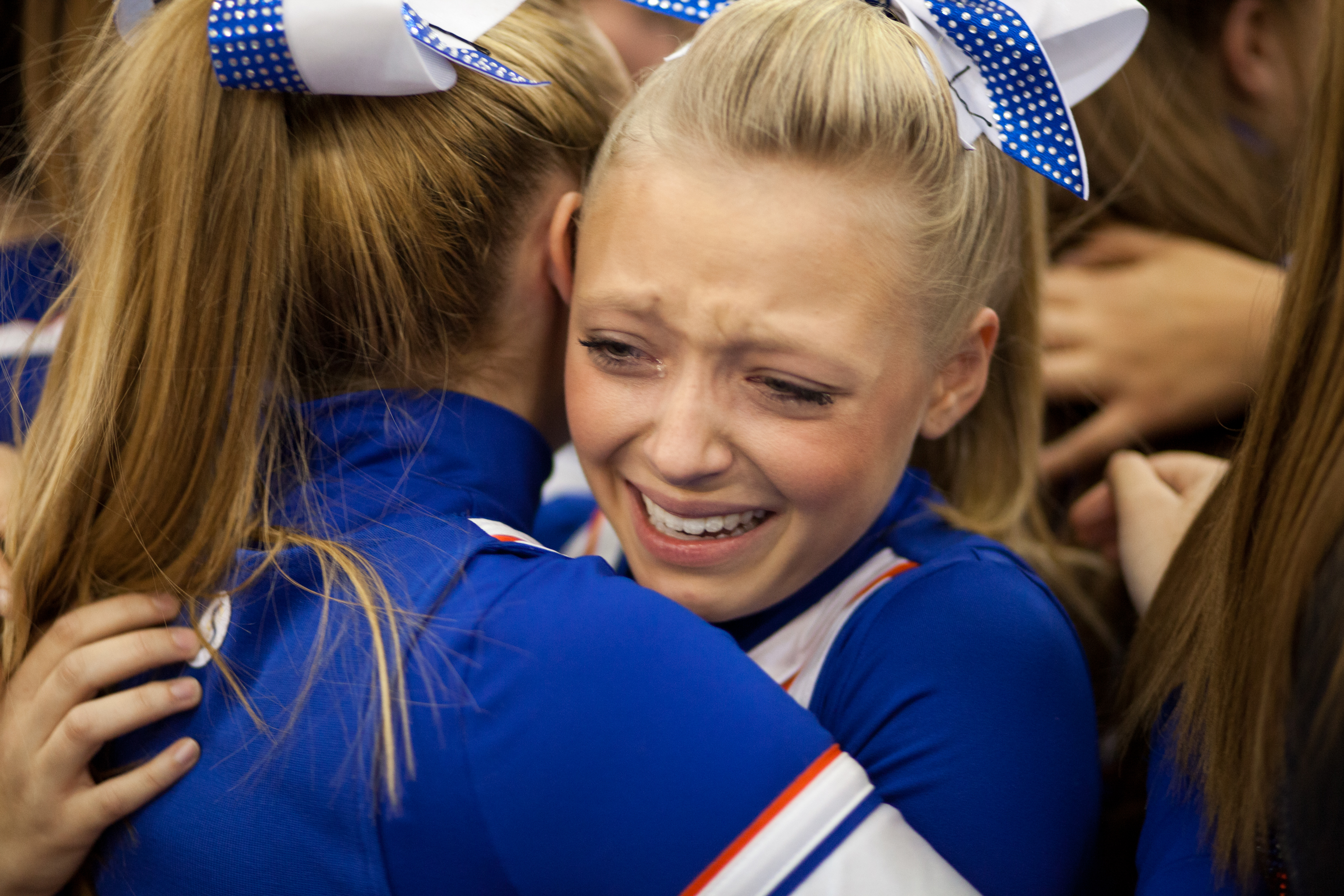 Livonia cheerleaders celebrate after taking first in Class B at the Section V Cheerleading Fall Sectional held at Gordon Field House on the Rochester Institute of Technology campus in Henrietta, New York, on  Nov. 26, 2013. Photo by Flannery Allison