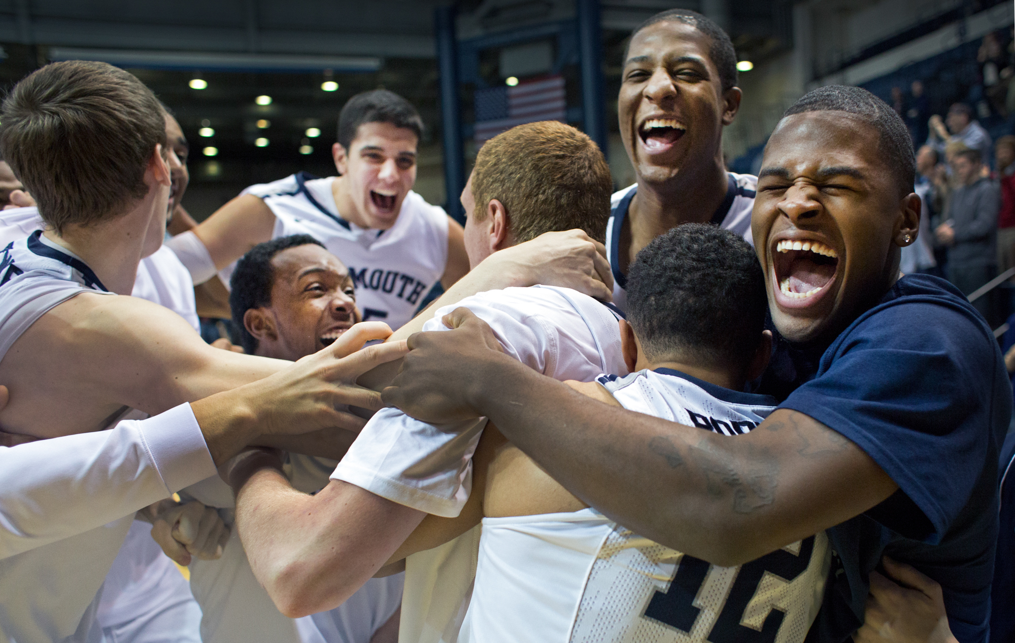 Monmouth University men's basketball celebrates after upsetting Canisus College 83-82 during a regular season game on January 19, 2014 at the Monmouth Activities Center in Long Branch, New Jersey. Photo by Tom Brenner