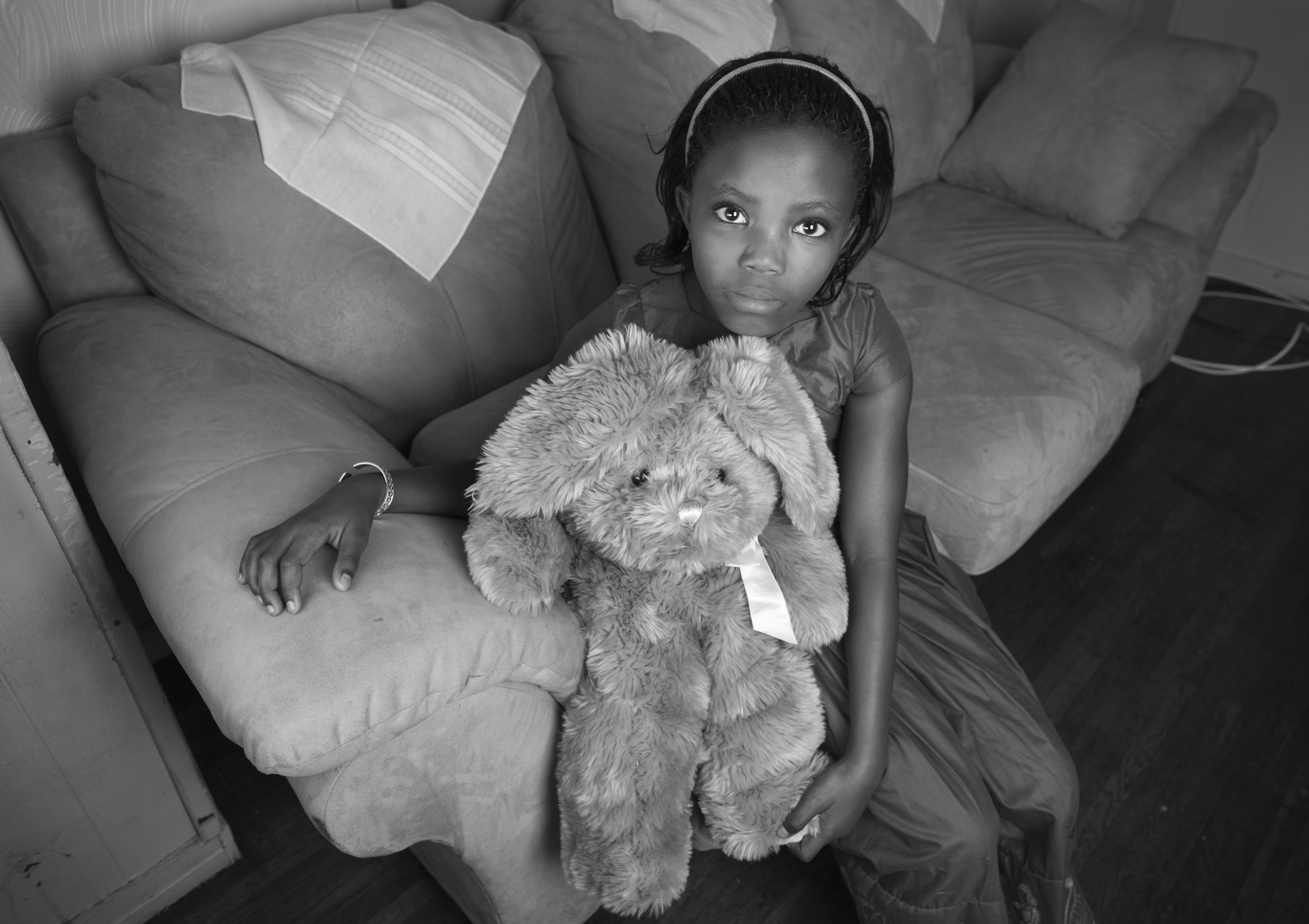 Nyota Kamali, 8, is a refugee from the Democratic Republic of Congo who recently arrived in the United States and moved into an apartment with her family in Rochester, NY. Saint's Place prepared the apartment before her family moved in, providing furniture, decorations and toys. Photo by Sarah Ann Jump