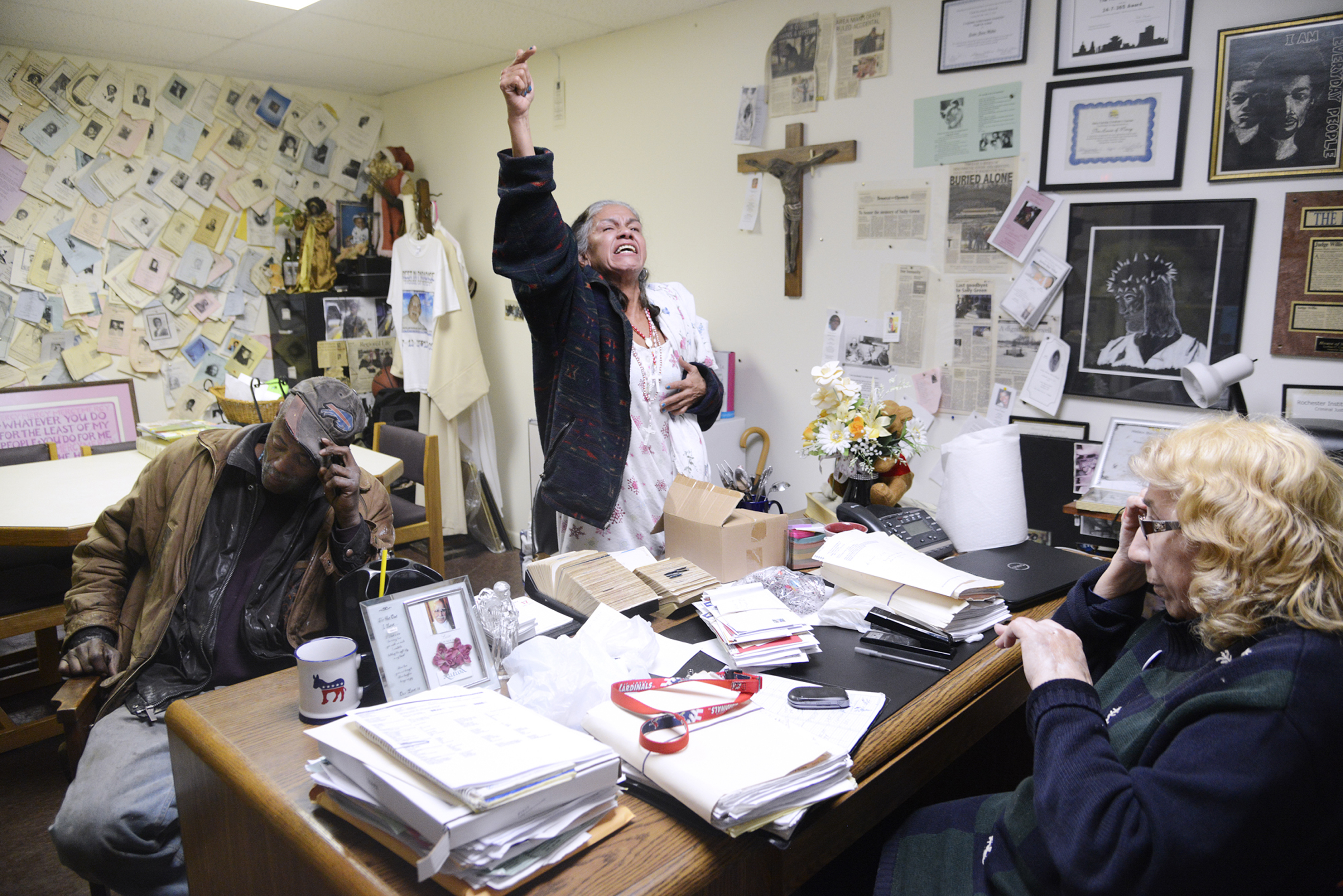 Sister Grace Miller, right, calls residents "Handyman", left, and Elena, center, into her office to resolve a dispute on Tuesday, December 17, 2013. Handyman was intoxicated and referred to Elena, who has breast cancer, as a "cancerous bitch." Photo by Emily Kask