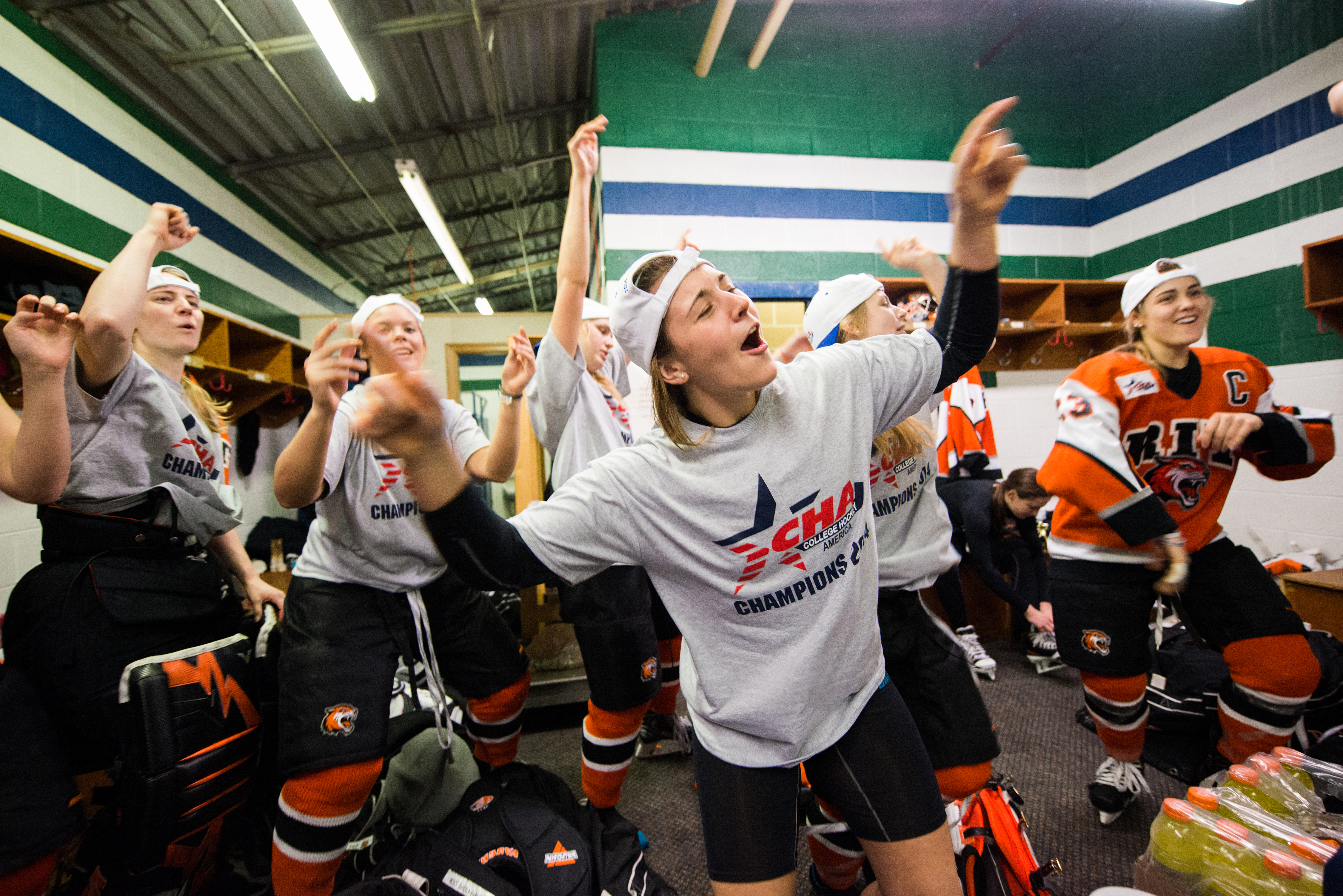 Members of RIT Tigers women's hockey team dance to Pitbull's "Timber" after winning the CHA Championship at Mercyhurst Ice Center on Saturday, March 8, 2014 in Erie, Pa. Photo by Josh Barber