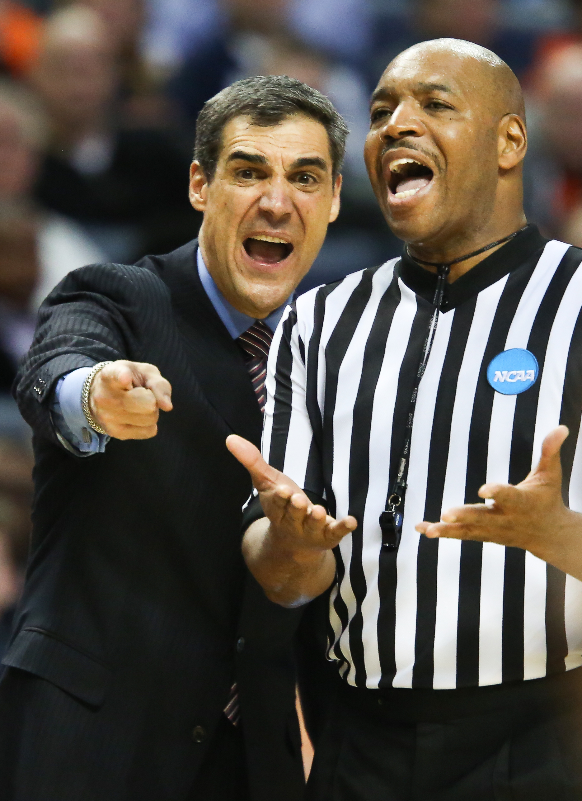 Head coach Jay Wright of the Villanova Wildcats argues a call with official Antinio Petty as his team trails late in the second half against the Connecticut Huskies during the third round of the 2014 NCAA Men's Basketball Championships at the First Niagara Center on Saturday, March 22, 2014 in Buffalo, N.Y Villanova lost 77-65. Photo By Josh Barber