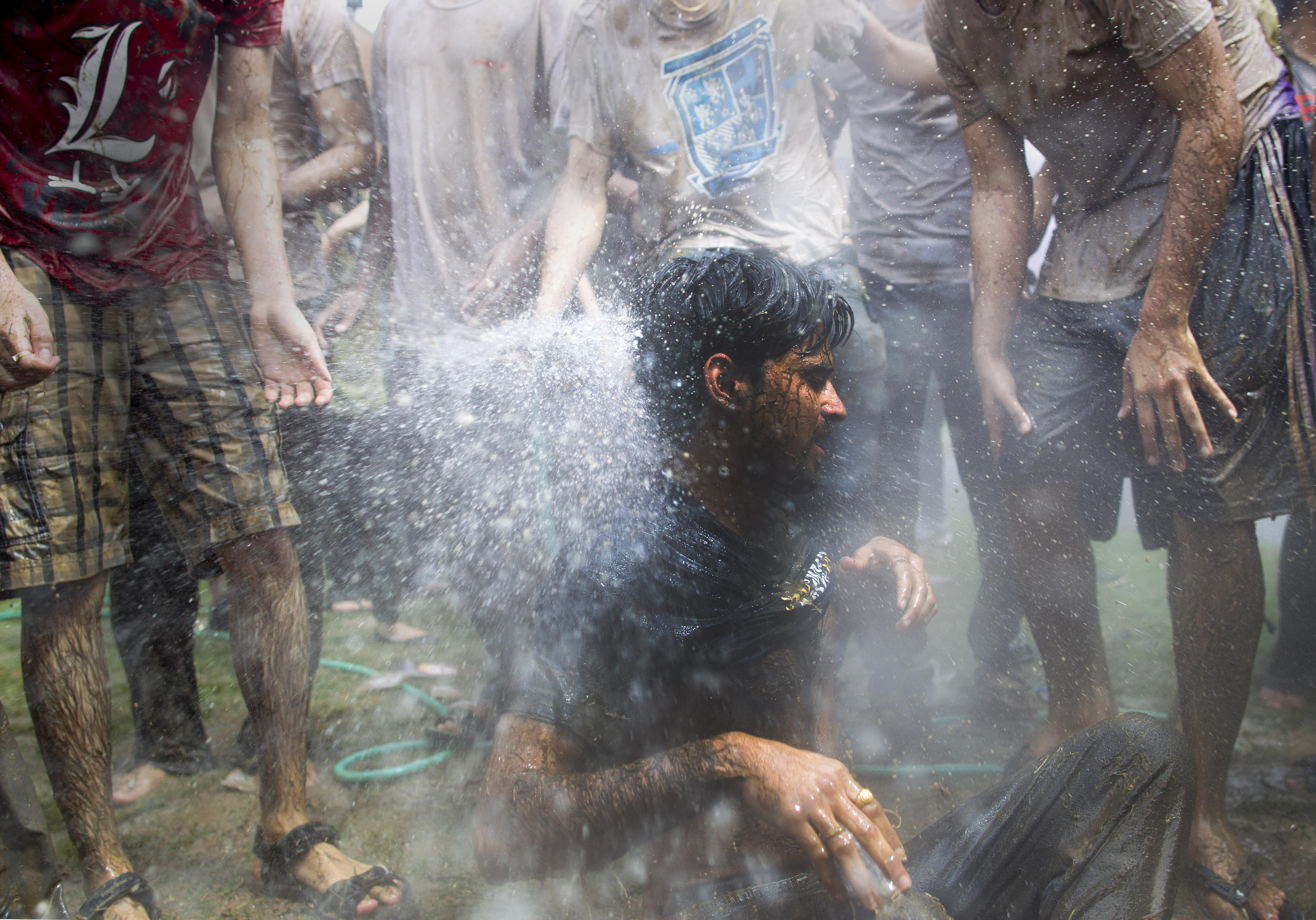 Rochester Institute of Technology student Sachin Gawande (cq) gets soaked by a garden hose during the Indian Holi Festival of Color on April 26, 2014 in Henrietta, New York.