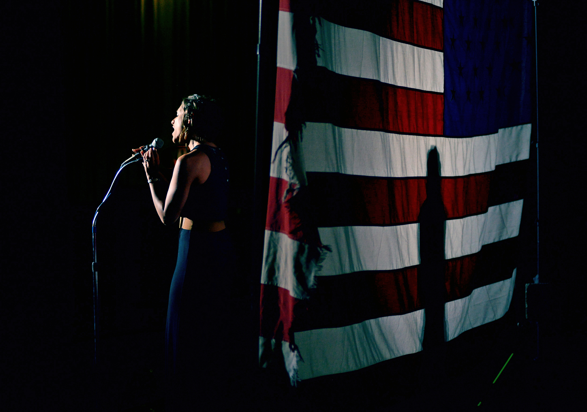 Kayti Stadler, 28, lead vocalist with Key West Express and Lucky Dog, sings "The Star-Spangled Banner" at the Erie Playhouse in Erie, Pa., on June 26, 2014.