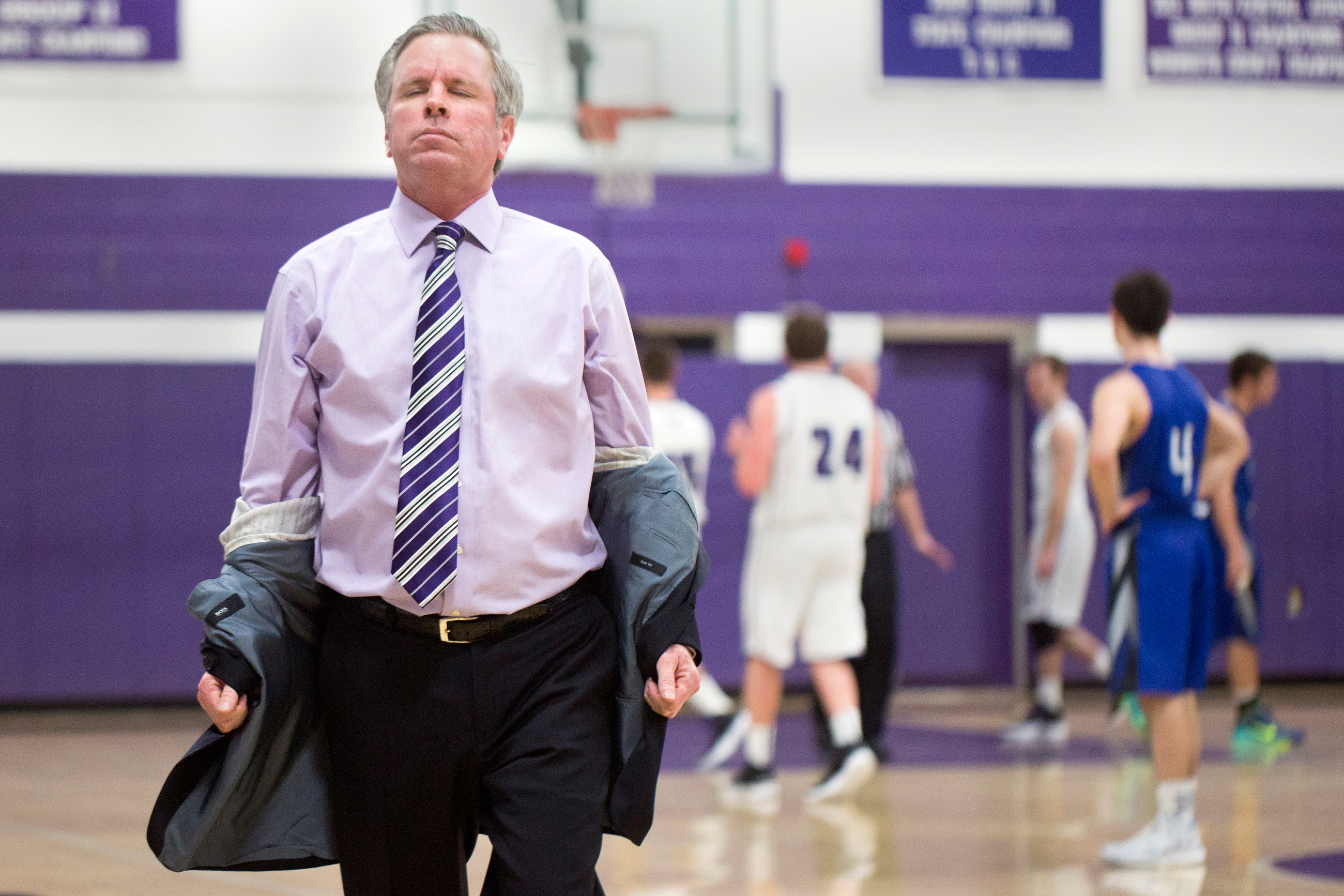  Rumson- Fair Haven regional high school Boy's Varsity head coach Chris Champeau pulls his jacket off in frustration after Jackson Reid #24, right, missed a foul shot that would tie the game, on January 6, 2015, in Rumson, N.J.