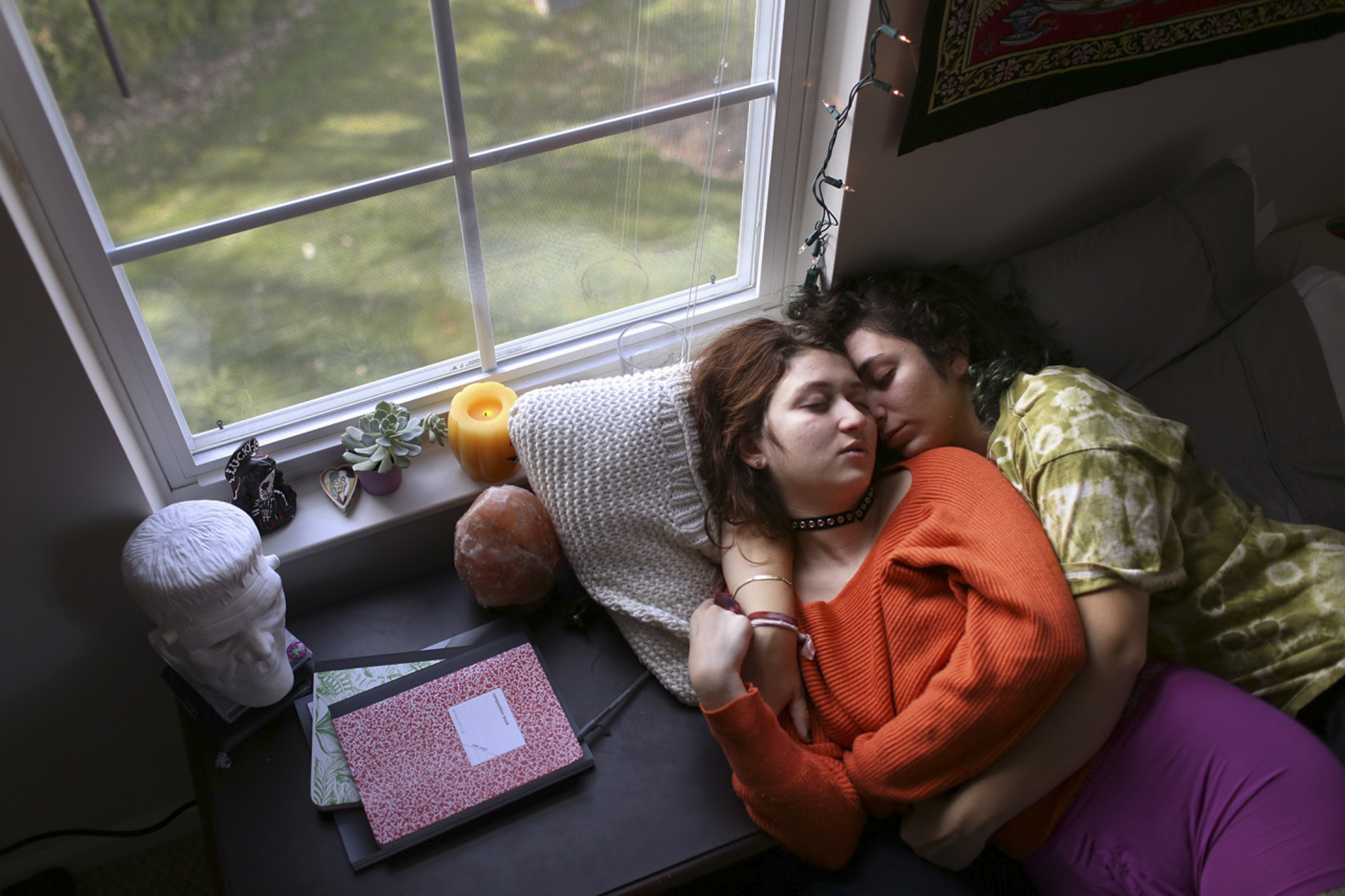 This is a portrait showing Rochester Institute of Technology students Jackie Spaventa and Sarah Zuckerman with the intimacy they share for one another. The two students have been in a relationship about one year, and have found comfort in each other.