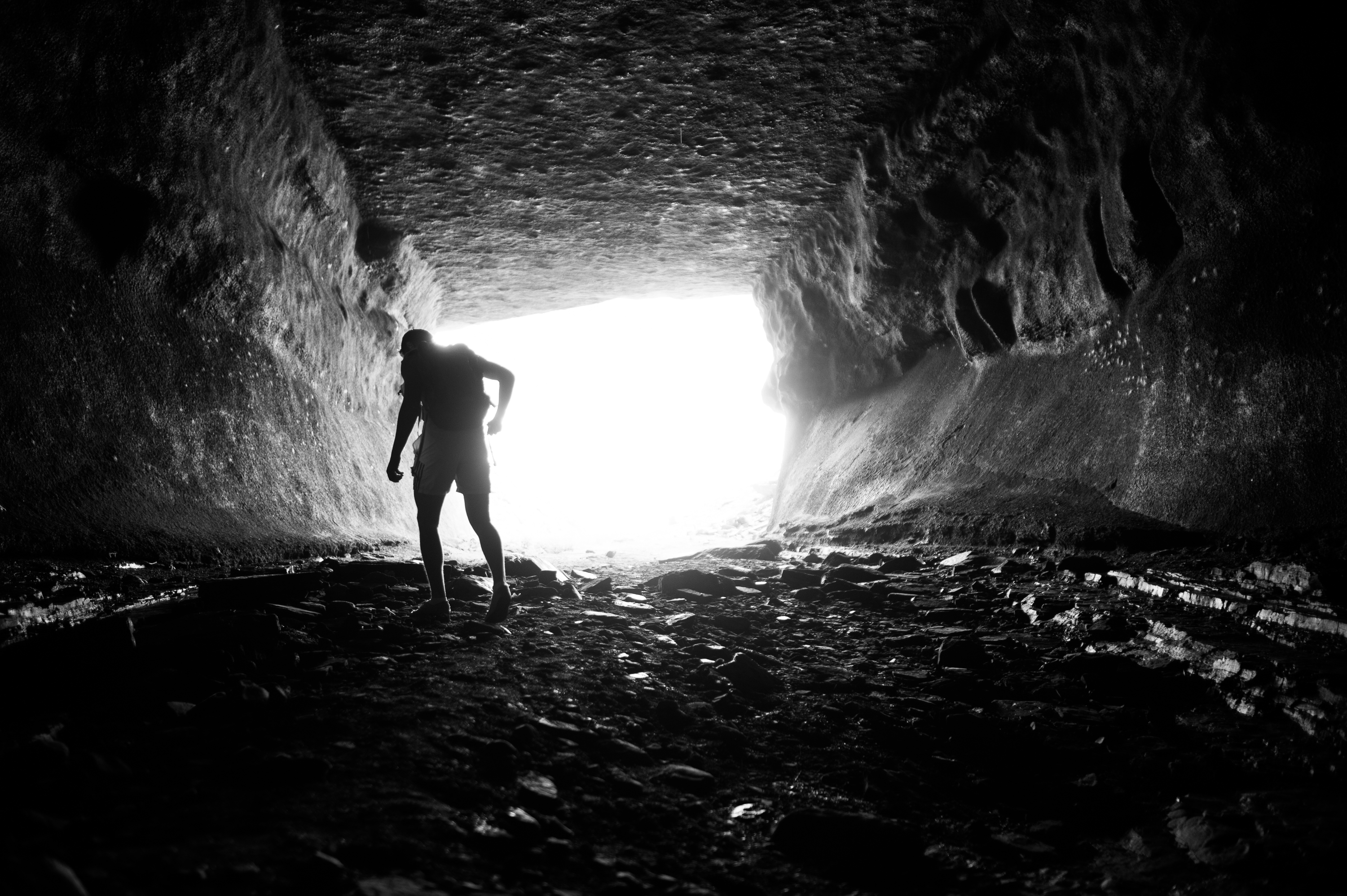 An RIT student explores a cave near Lower Falls in Rochester, NY.