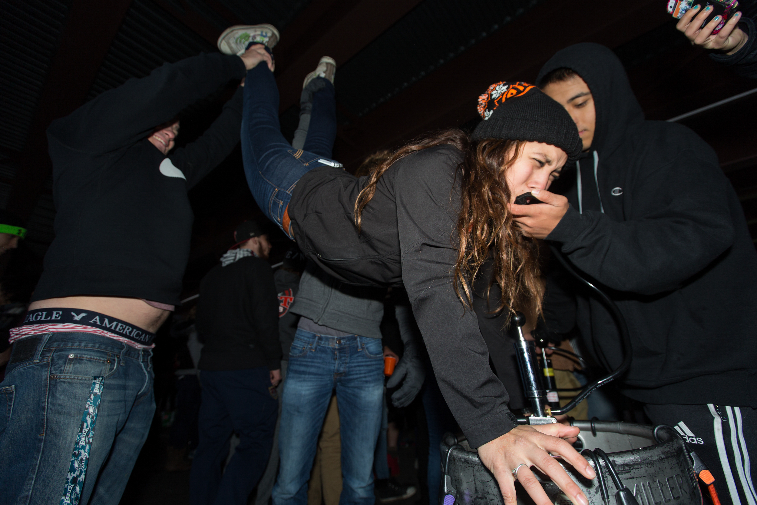 Daniella Reyna, a second year Business student at the Rochester Institute of Technology, participates in her first keg stand in a parking lot before RIT's Homecoming Game versus Bowling Green at Blue Cross Arena in Rochester, N.Y. on Oct. 17, 2015.