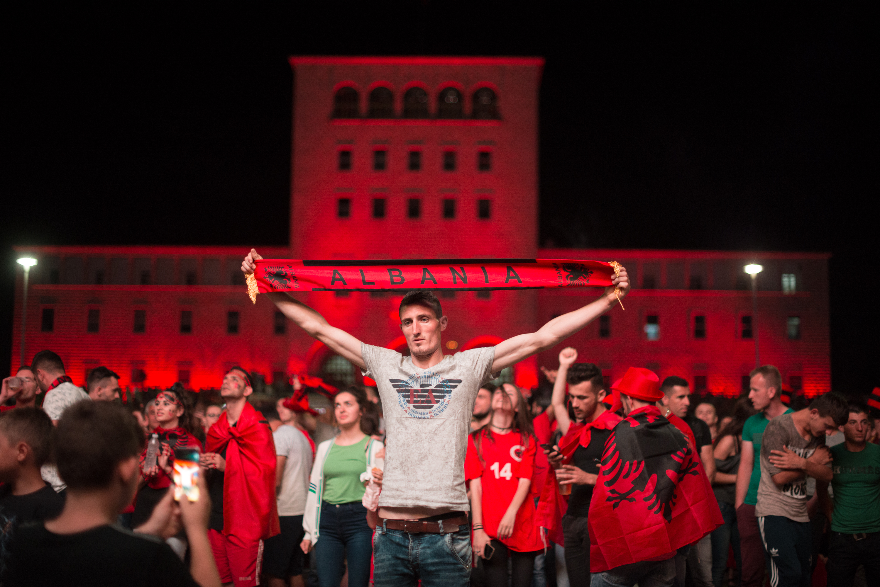 Albanian soccer fans celebrate after their country won the Group A match against Romania in Tirana, Albania on Sunday June 19, 2016. Albania defeated Romania 1-0.