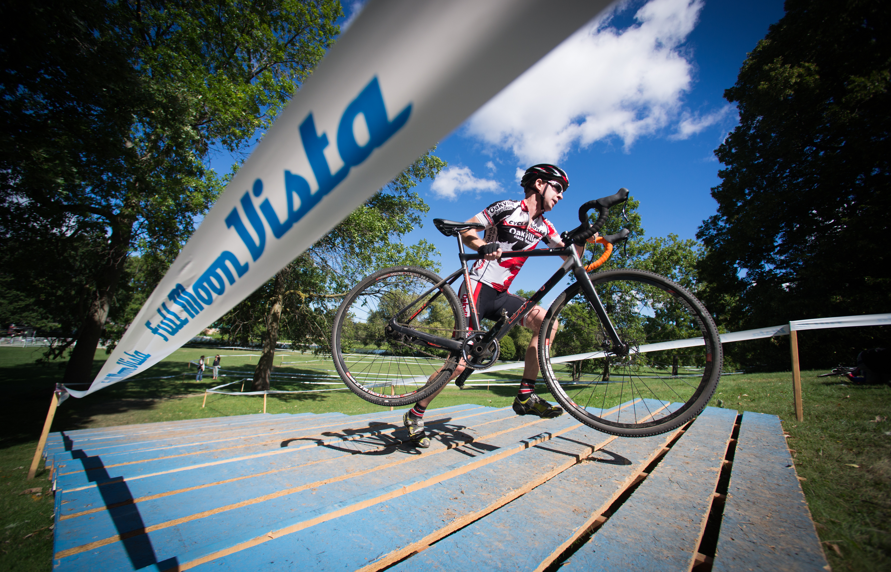 Mark Stuart climbs up the stairs at the Rochester Cyclocross course at Genesee Valley Park in Rochester, N.Y. on Sept. 11, 2016. Stuart placed first in his division.