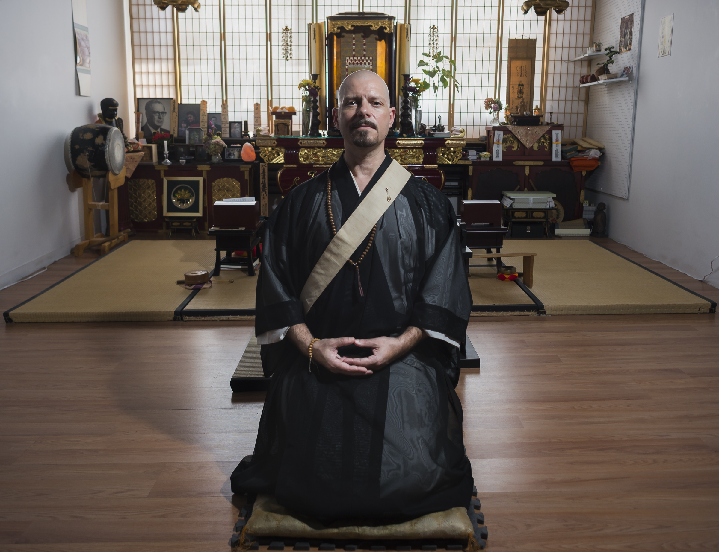 Cody Kroll, a Buddhist priest, poses for a portrait in the Enkyoji Buddhist Temple, located in the Hungerford building, in Rochester, N.Y., on Sept. 18, 2016. As a Buddhist priest, Kroll assumes the name and tittle Shami Kanyu Kroll while leading services, and teaching the dharma at the Enkyoji Buddhist Temple. During the day Kroll also works as a high school photography teacher.